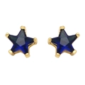 Close-up of royal blue star-shaped zircon earrings with gold claw settings in detail - Sapphire Blue Zirconia