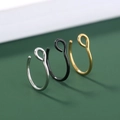 Detailed macro view of minimalist U-shaped nose rings in silver, black, and gold finishes - SE1651 3-Color U-Shape Set