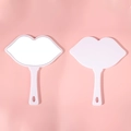 Pair of white lip-shaped handheld makeup mirrors with front and back views on pink background - 18*21.5 Large White
