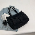 Black corduroy tote bag with dual front flap pockets and adjustable crossbody strap - Black