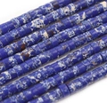 Detailed macro view of flat blue and white marbled stone spacer beads for DIY jewelry - Lapis Blue Pattern