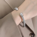 Silver twisted cable cuff bracelet with polished end caps in a trendy minimalist style - Z015-Twisted Cable Ball Cuff Bracelet / Steel
