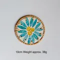 Detail of 10cm handwoven rattan coaster with decorative blue and yellow daisy shell inlay - Blue Leaf Yellow Fruit 10CM