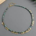 Boho turquoise beaded necklace with textured gold disc pendants on dark background - Bohemian Disc Pendant