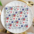 Square party napkin with red, blue, and white floral print on a white plate - Red Blue White Floral (1091)
