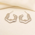 Macro shot of silver irregular geometric earrings on soft beige fabric background - Irregular Lava Molded Style (D189-S)