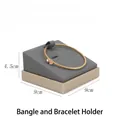 Detailed view of a grey velvet jewelry display tray with dimensions 9cm x 9cm x 4.5cm - Slanted Bangle Display