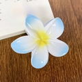 Blue and white gradient plumeria hair claw clip with yellow center on wood background - Blue Gradient