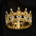 Detailed macro of golden baroque crown with yellow gems and heart-patterned base rim - Gold + Champagne Drop