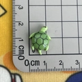 Detailed scale view of a mini green resin sea turtle charm showing 1.5cm dimensions - Sea Turtle