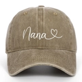 Detail of Nana heart embroidery on vintage washed khaki cotton baseball cap texture - Khaki