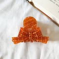 Elegant amber acetate hair claw clip with golden grid pattern and ribbon bow design - 8cm / Orange Plaid