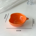 Detail view of orange apple-shaped ceramic bowl with 10.5x4.3cm dimensions specified - Pumpkin