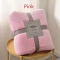 Pink pineapple textured flannel blanket neatly folded with grey ribbon and product tag - Girl Pink