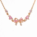 Bracciale in oro rosa con fiocco e cuore di zircone rosa e cristalli scintillanti - Bracciale con Fiocco Oro Rosa