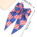 Independence Day bow hair clip with American flag pattern and streamer in red white blue - Stars and Stripes Pattern