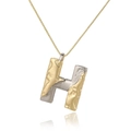 Detail of gold and silver tone letter H pendant with irregular lava texture on box chain - Letter H