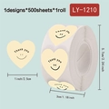Cream heart-shaped 'Thank You' stickers with smiley faces, 500 labels per roll - Cream Thank You Smile