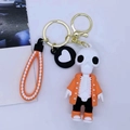 Creative cartoon skull keychain with orange jacket and orange-white braided wrist strap - Orange