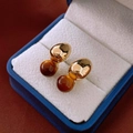 Macro view of 14k gold plated earrings with round tiger eye stone in a jewelry box - Irregular Metal Studs (12#)