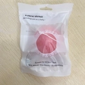Pink konjac facial sponge in white translucent plastic sealed bag with hanging hole - Bag Packaging / Sakura Pink
