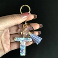 Detail of resin letter T keychain with glitter hearts, purple butterfly and blue tassel - Letter T / Butterfly Tassel 8-Shape Buckle