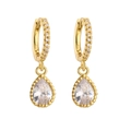 Macro shot of gold-plated huggie earrings with sparkling pear-cut zircon pendants - Gold Waterdrop