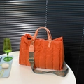 Orange quilted puffer tote bag with pink handles and a bohemian style wide strap - Orange