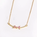Close-up of golden necklace with pink zircon bow pendant on white background - Style 1 Gold (Pink Zirconia)