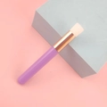 Detailed view of lash cleansing brush with purple handle and soft white bristles - Purple