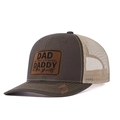 Mesh trucker hat in dark brown and beige featuring a custom leather Dad patch - Coffee+Khaki