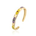 Detalle del brazalete bohemio chapado en oro con ojos de esmalte de colores y circonita - Dorado/Multicolor