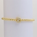 Macro detail of gold bubble bead bracelet featuring a luxury zircon paved letter Z charm - Letter Z
