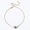 18K gold plated stainless steel bracelet with cherry pendant and red gemstones on white background - Bracelet / Gold+Fuchsia