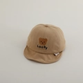 Close-up of baby baseball cap featuring brown bear embroidery and Lucky text detail - 50cm 1-2 Years / Light Khaki