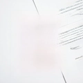 Detailed close-up of wide-tooth comb with black and white marble pattern on open book - Black & White Marble