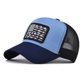 Detail of creative fish flag patch on a color-block mesh trucker hat for outdoors - Navy and Blue (Navy+Blue Flag Fish)