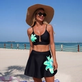 Two-piece black floral bikini set with metal closure top and A-line swim skirt - S / Black Green Floral