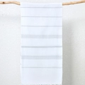 White Turkish towel with light gray stripes and woven fringe hanging on a wood branch - 90x180cm / White + Grey