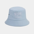 Detail of light blue cotton bucket hat with white 'NOPE' embroidery and metal eyelets - M (56-58cm) / Light Blue