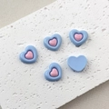 Detailed view of colorful resin heart charms for DIY crafts on a textured white stone - 2# Blue and Pink