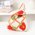 Floral knitted tote bag in cream white with vibrant red flower and orange accents - Checkered Red Green Flower