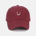Detailed embroidery of a white smiley face on a burgundy cotton twill baseball cap - Adjustable / Burgundy