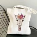 White canvas tote bag featuring a colorful giraffe floral print with wide shoulder straps - C7 Hand-painted Giraffe
