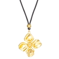 Gold four-leaf clover pendant on a black cord necklace with metallic finish and texture - Gold Flower Necklace