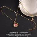Titanium steel rotating clover necklace in gold finish with pink gemstone and zirconias - Pink Gemstone Sunburst Style (A853)