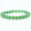 Detail view of 8mm green tiger eye agate beads with natural texture on a beaded bracelet - Light Green Crystal Style