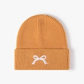 Winter mustard yellow knitted beanie with a white bow embroidery on a folded cuff - Orange Red