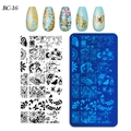 Macro shot of rectangular nail stamping plate BC-16 with floral and butterfly patterns - Plant Goldfish Abstract Line Style (BC-16)