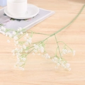 Macro detail of white artificial Gypsophila flower with lifelike petals on wooden background - Diamond-White